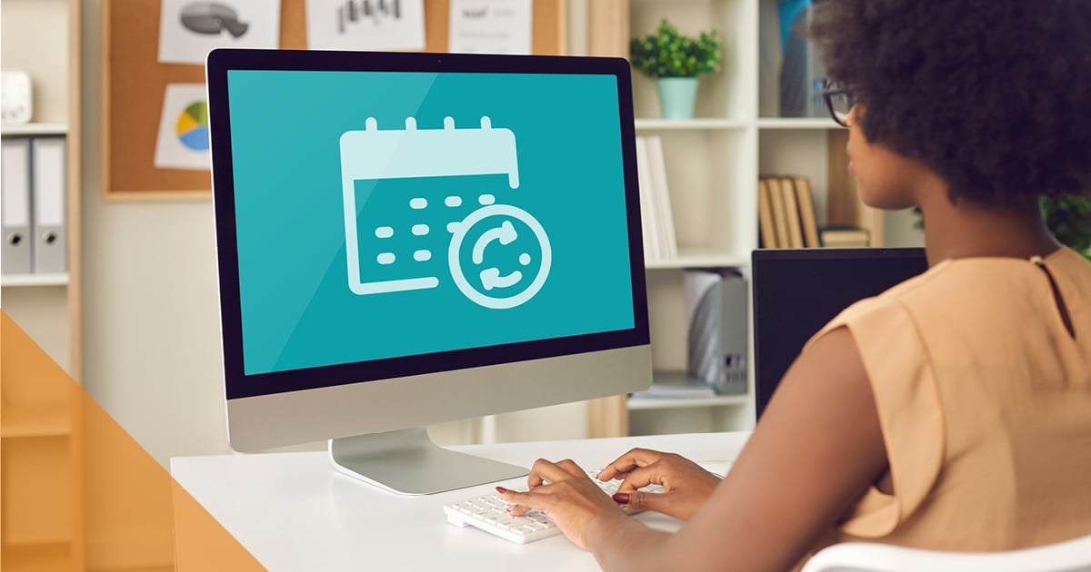 Woman sitting in front of computer typing